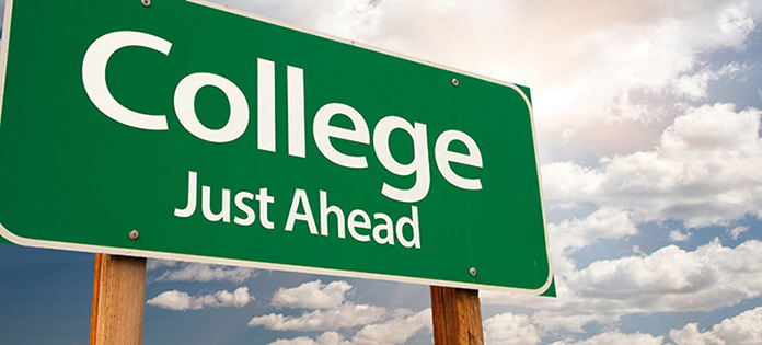 Green highway sign saying "College Just Ahead"